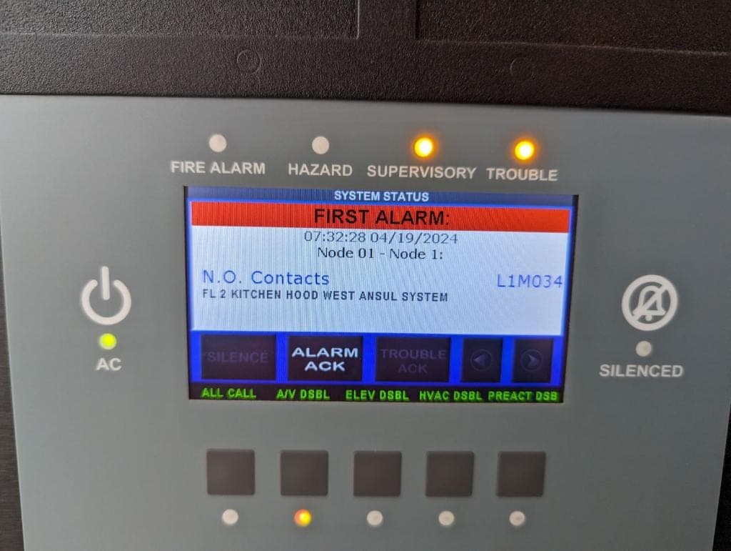 Building fire alarm panel showing an alarm from the kitchen hood Ansul system during the interlock test